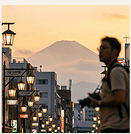 Tokyo street at dusk with Mount Fuji